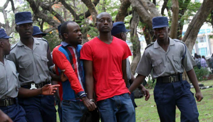 MIssing journalist and activist Itai Dzamara being arrested by police for demonstrating against President Robert Mugabe